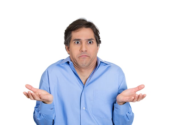 Closeup portrait of dumb, clueless, funny looking young man, arms out asking whats problem, who cares, so what, I dont know, isolated on white background. Negative human emotions, facial expressions